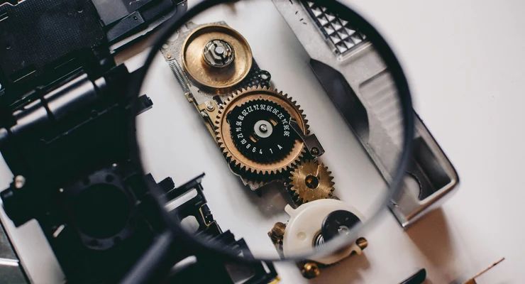 Mechanical components under magnification representing the hidden systems that shape how individuals are perceived